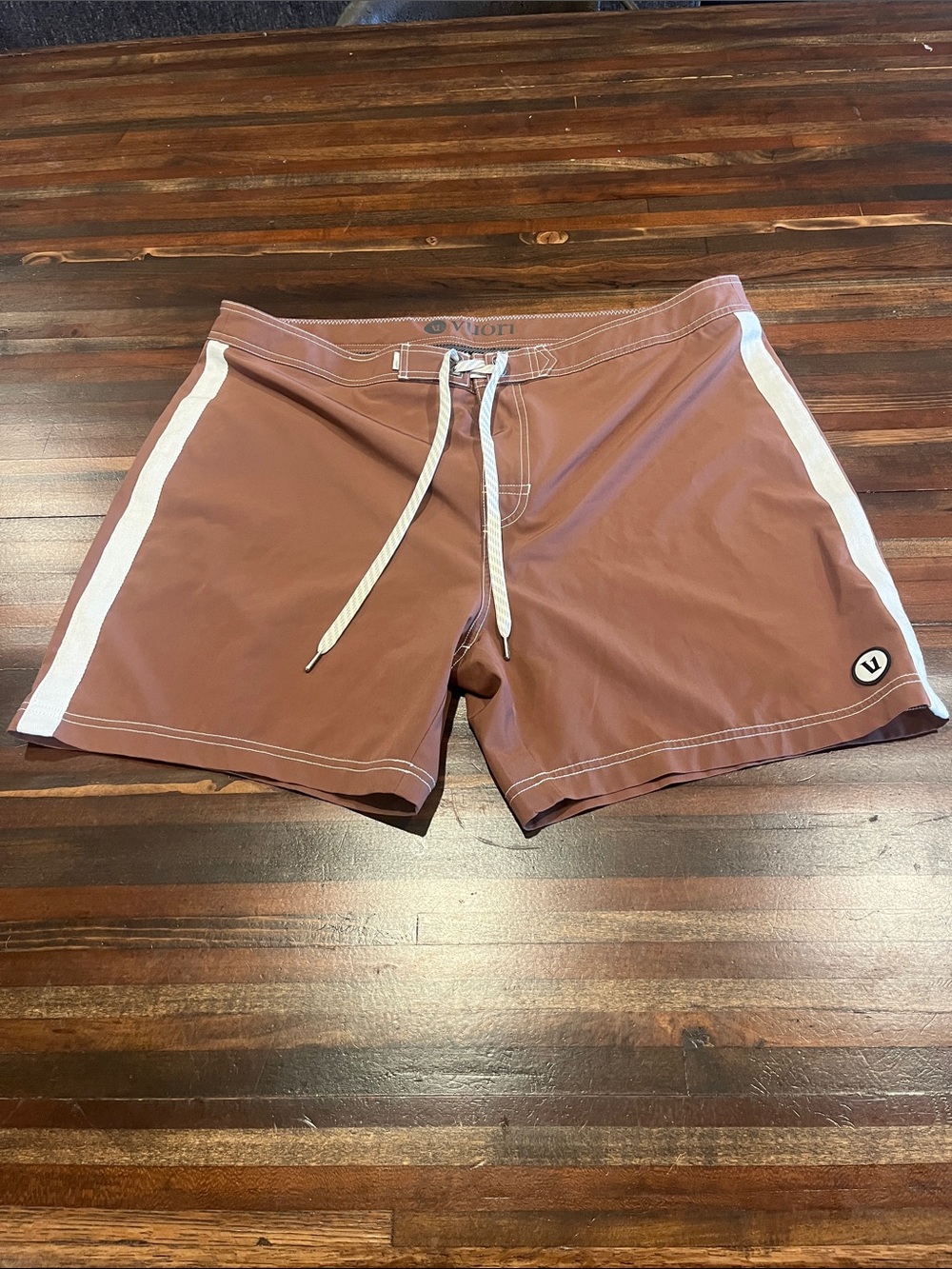 Vuori Men's Rust-Brown Swim Shorts with White Side Stripes large